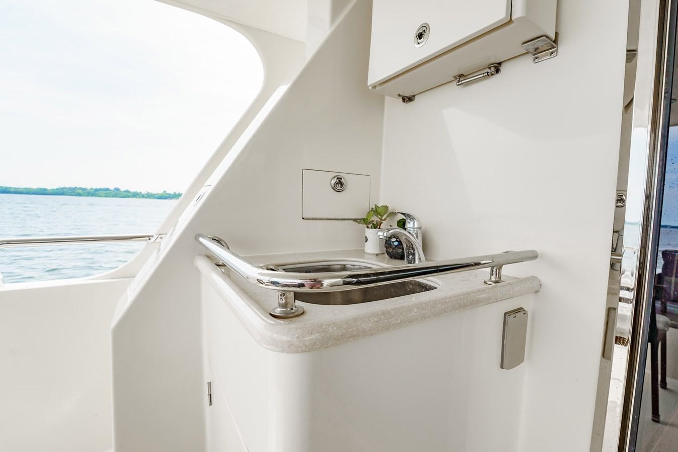 a sink in a bathroom aboard THREE OF A KIND Yacht for Sale