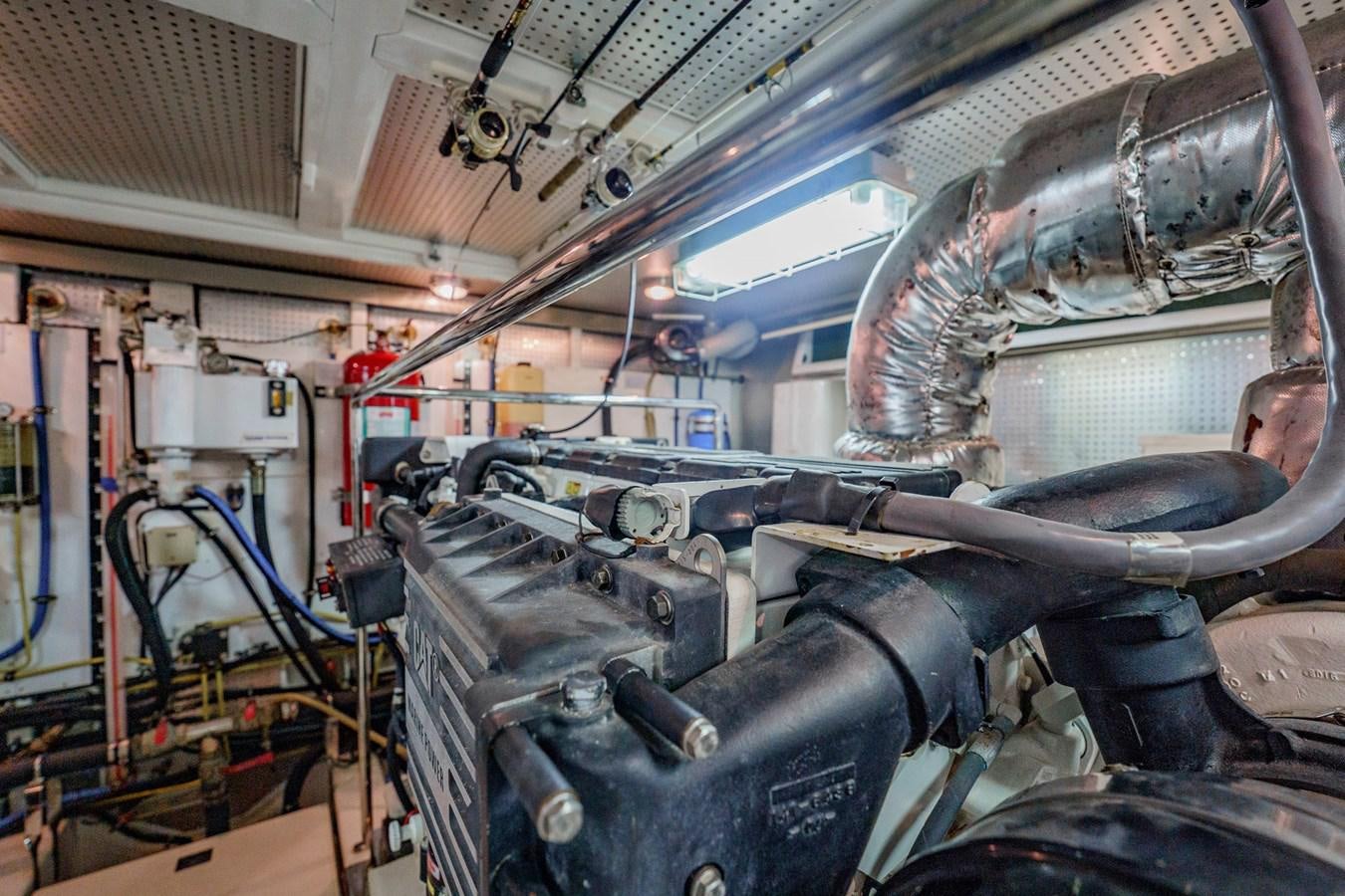 a large machine with metal pipes aboard THREE OF A KIND Yacht for Sale