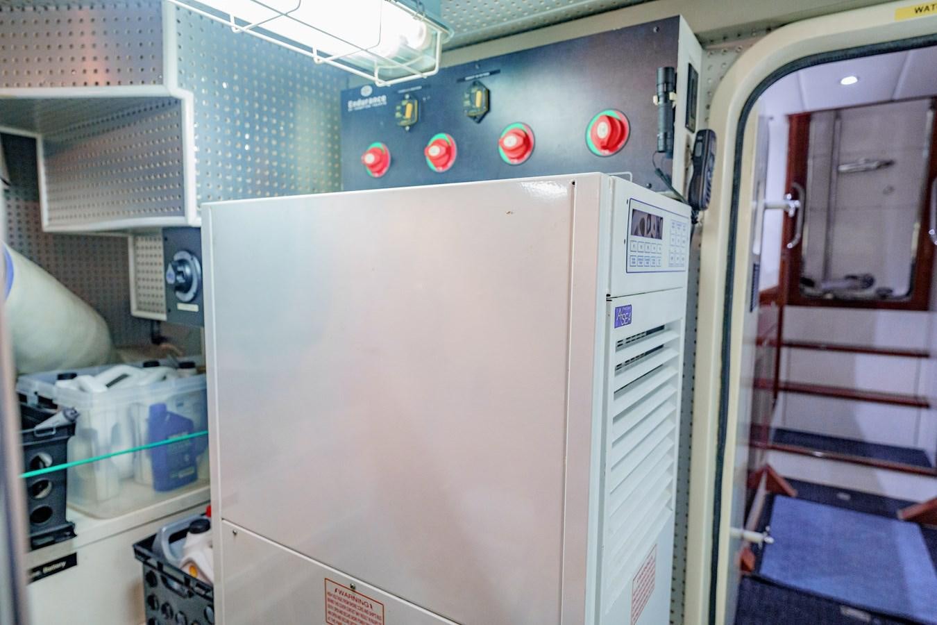 a large white machine aboard THREE OF A KIND Yacht for Sale