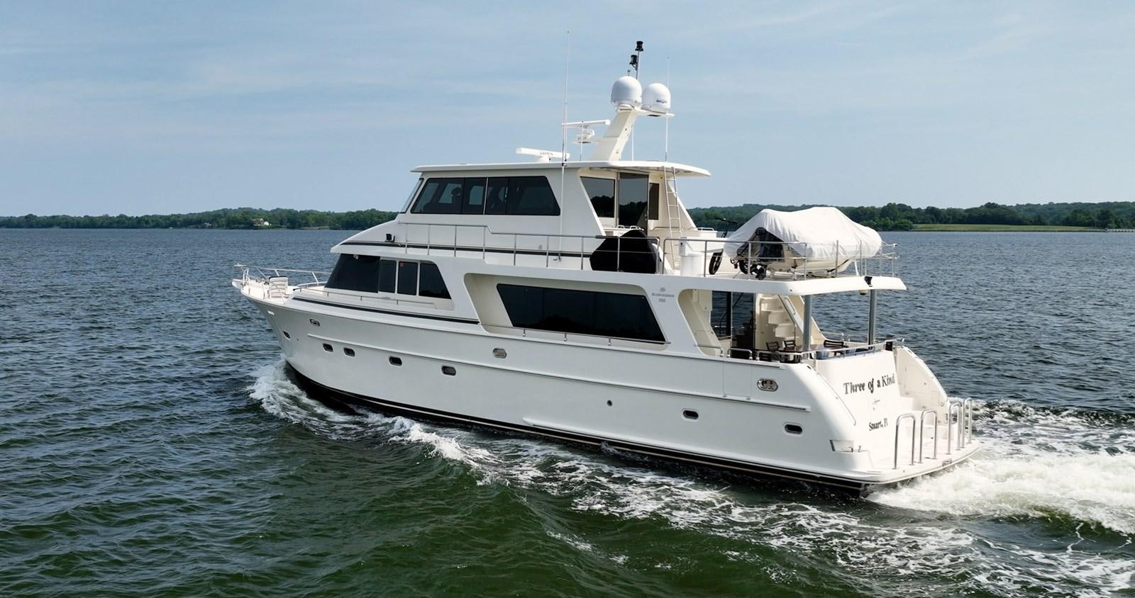 a boat on the water aboard THREE OF A KIND Yacht for Sale