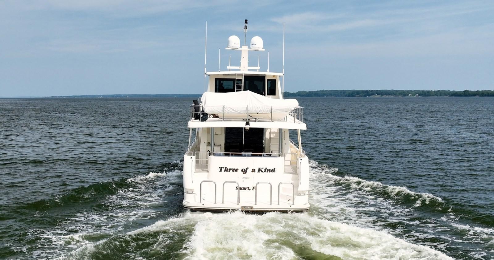 a boat on the water aboard THREE OF A KIND Yacht for Sale