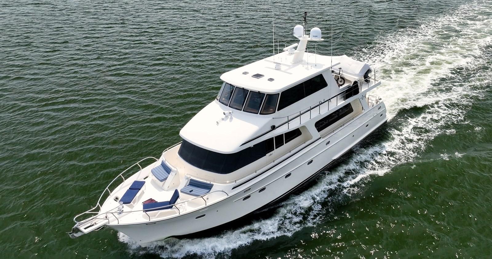 a boat on the water aboard THREE OF A KIND Yacht for Sale