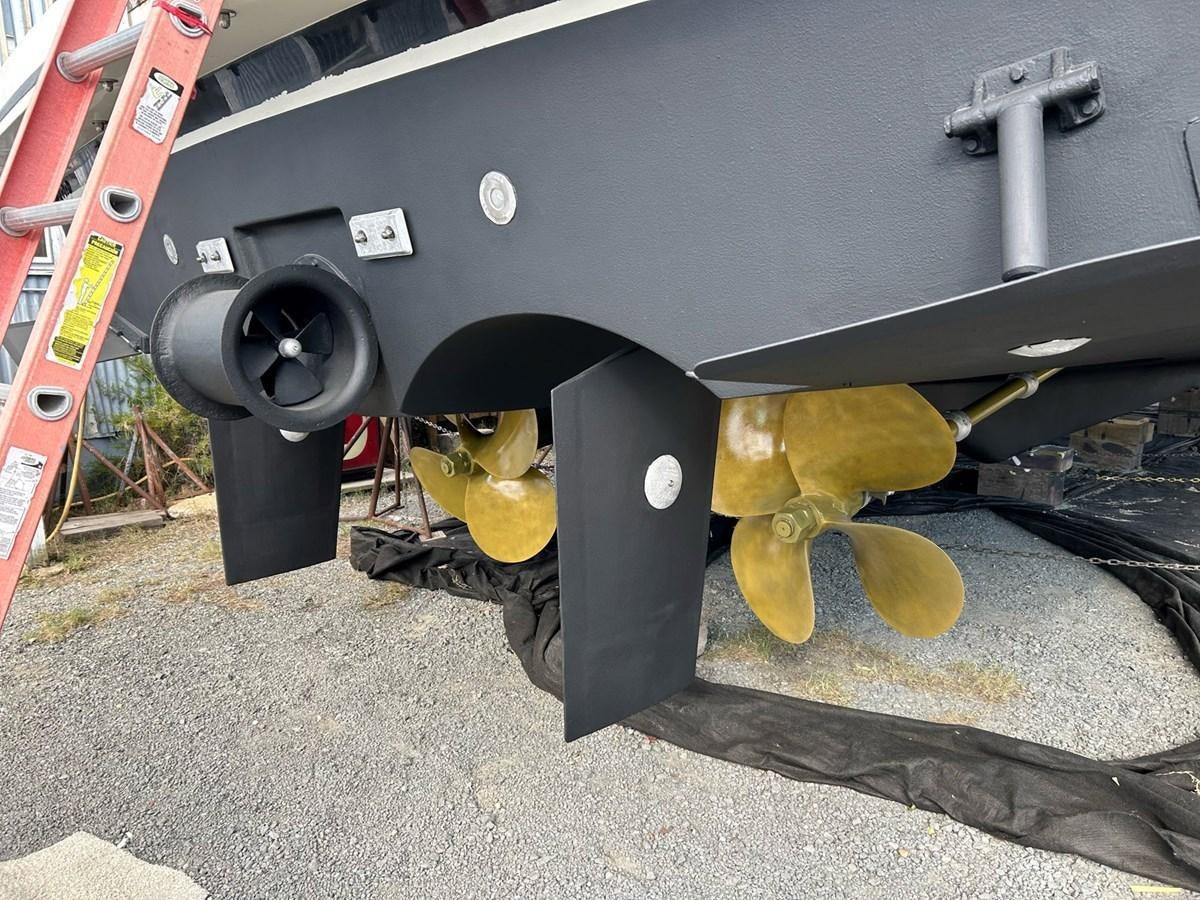 a car under a car aboard THREE OF A KIND Yacht for Sale