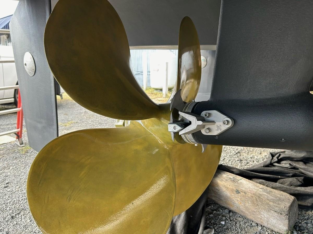 a large metal object with a large propeller aboard THREE OF A KIND Yacht for Sale