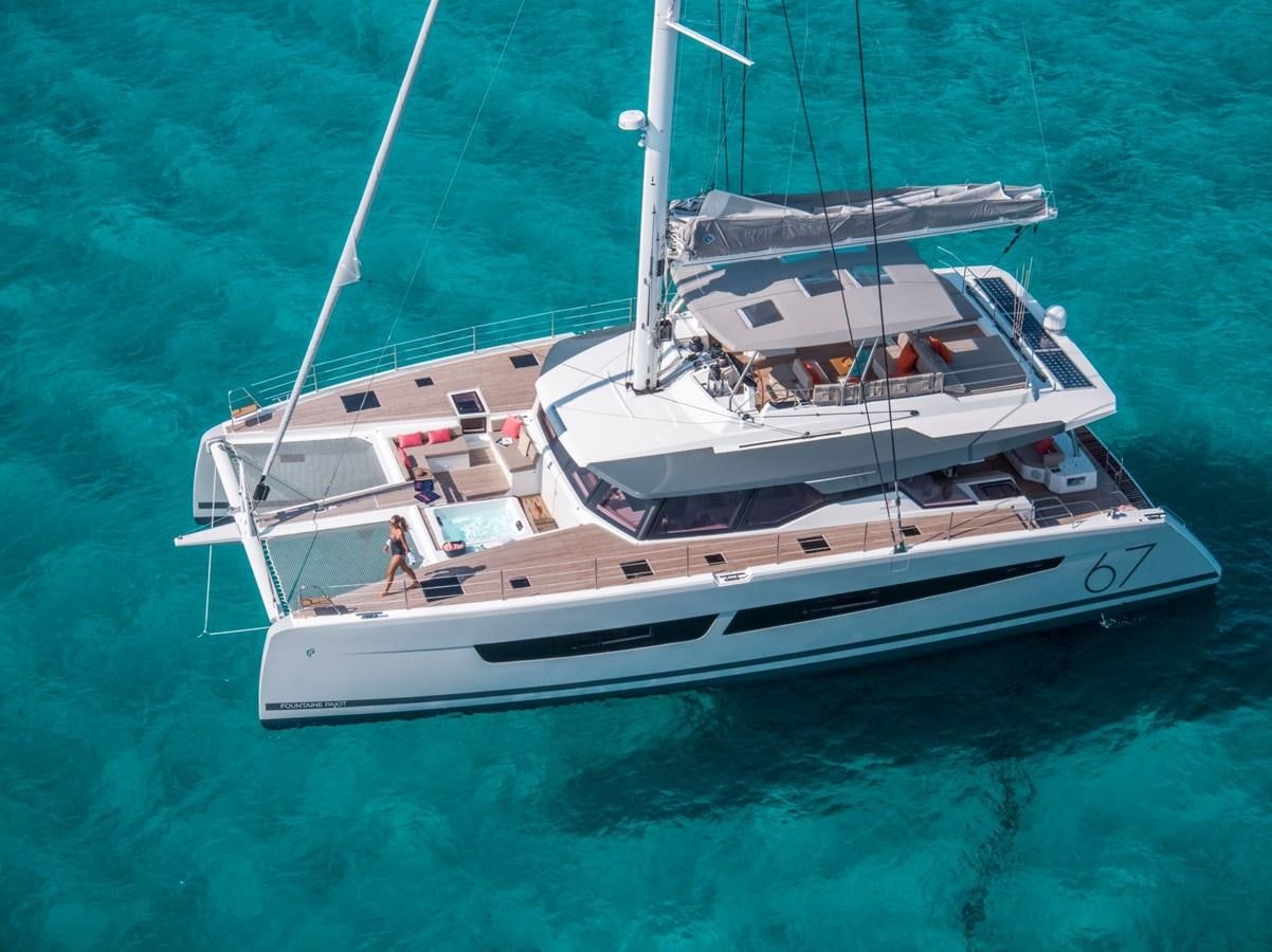 a white boat in the water aboard ALEGRIA 67 Yacht for Sale
