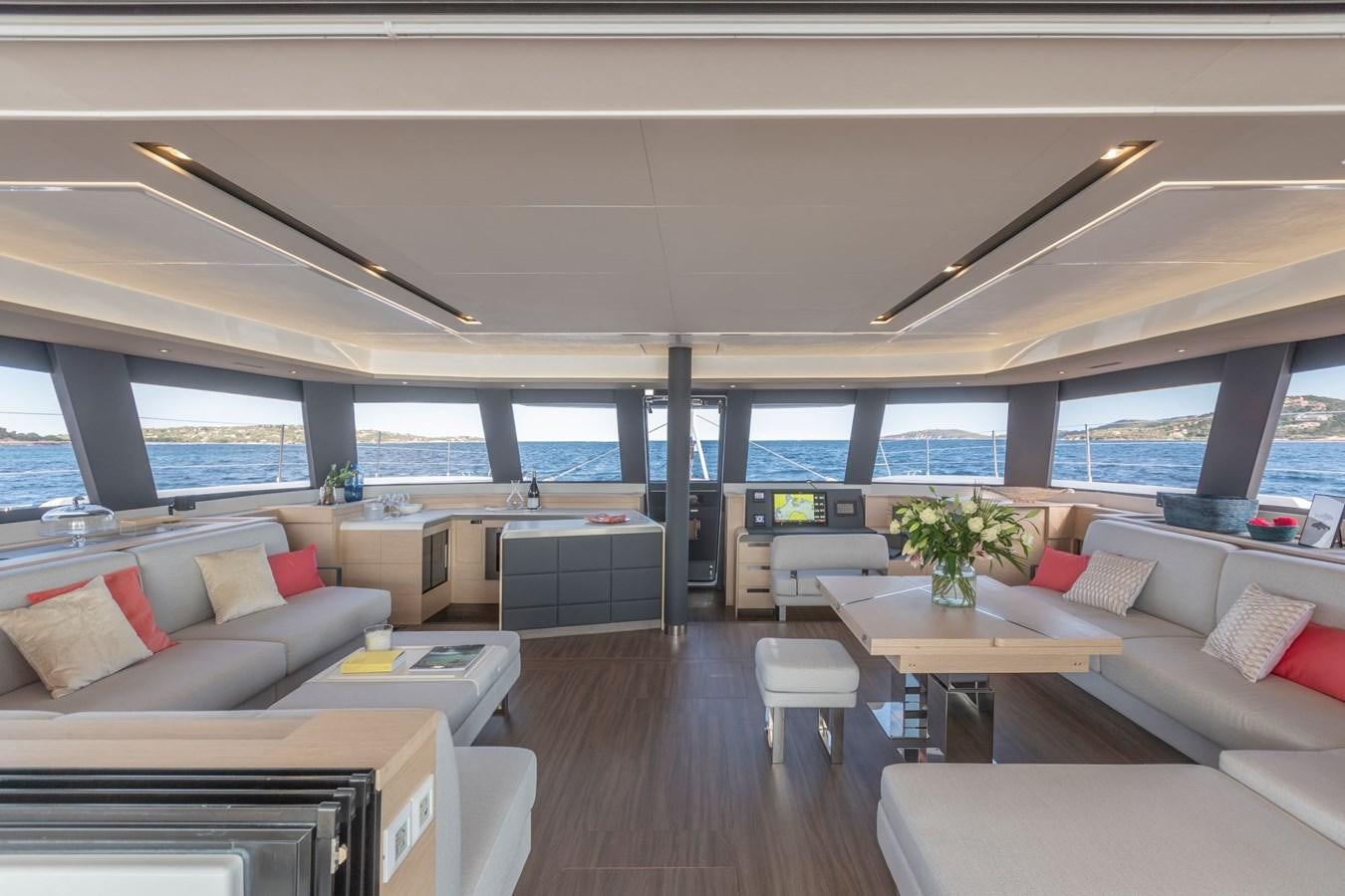a living room with a large window aboard ALEGRIA 67 Yacht for Sale