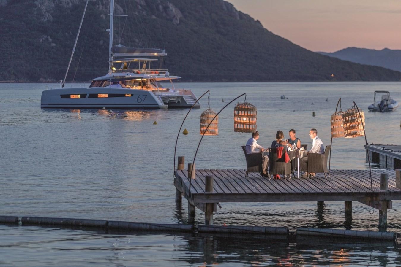 a group of people on a dock aboard ALEGRIA 67 Yacht for Sale