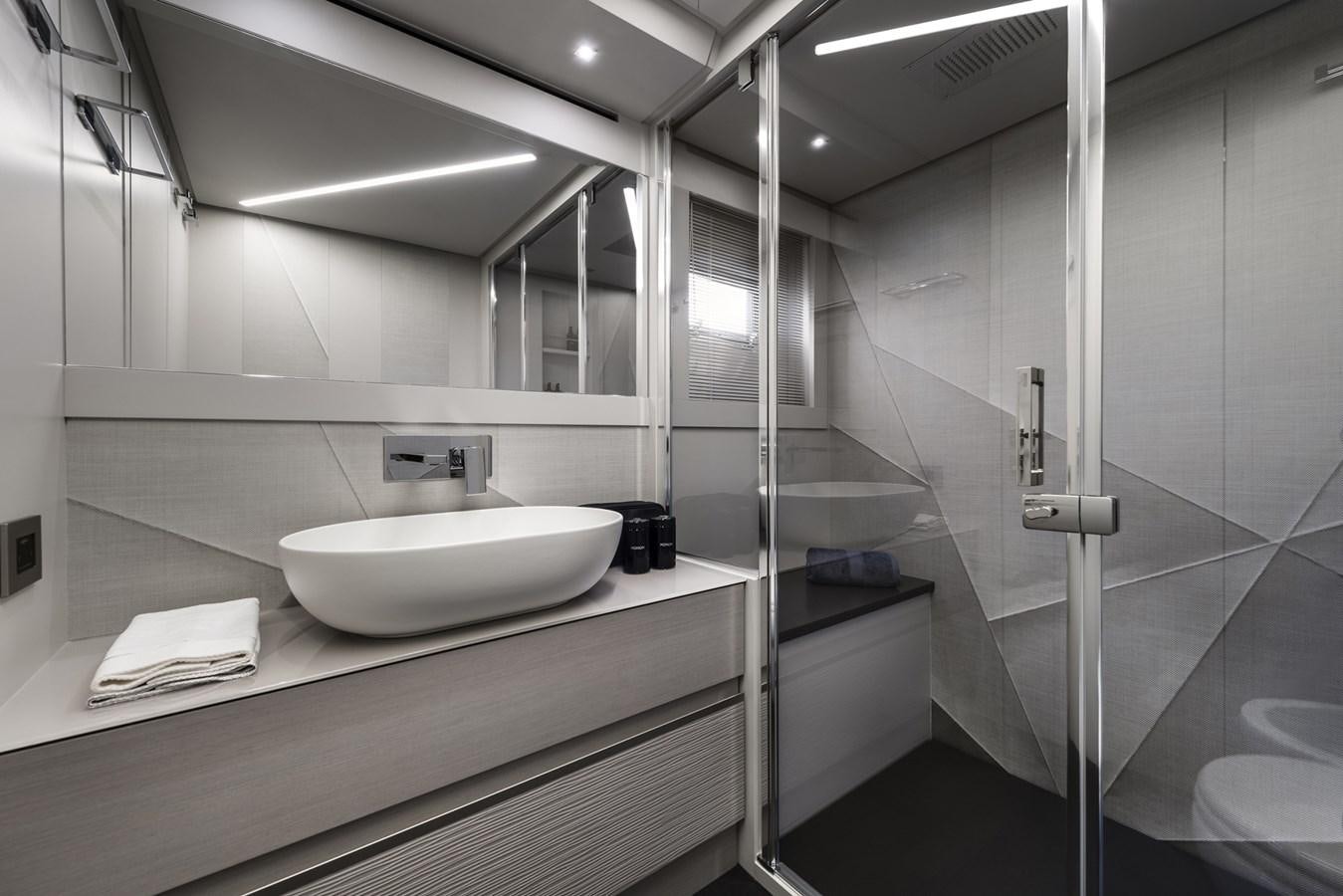 a bathroom with a sink and a mirror aboard NANCE Yacht for Sale