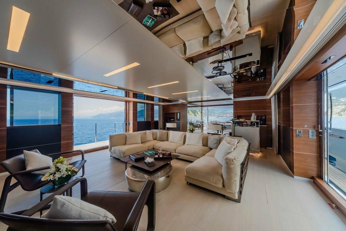 a living room with a large window aboard LADY A Yacht for Sale