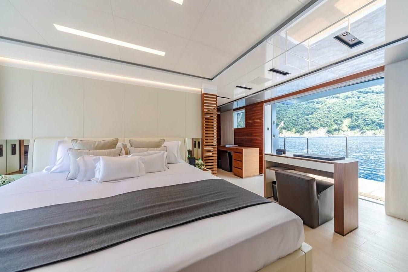 a large bedroom with a large window aboard LADY A Yacht for Sale