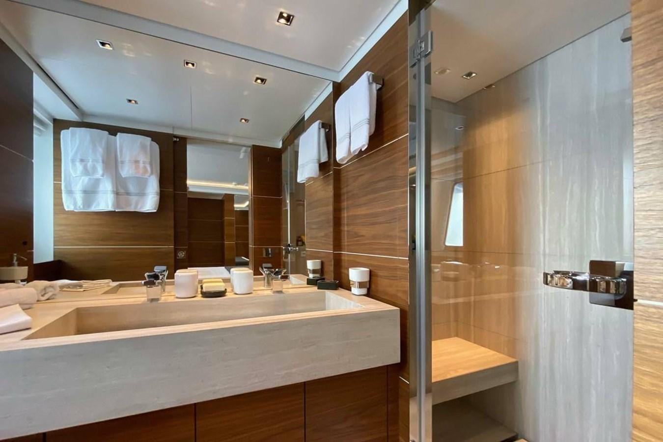 a bathroom with a large mirror aboard LADY A Yacht for Sale