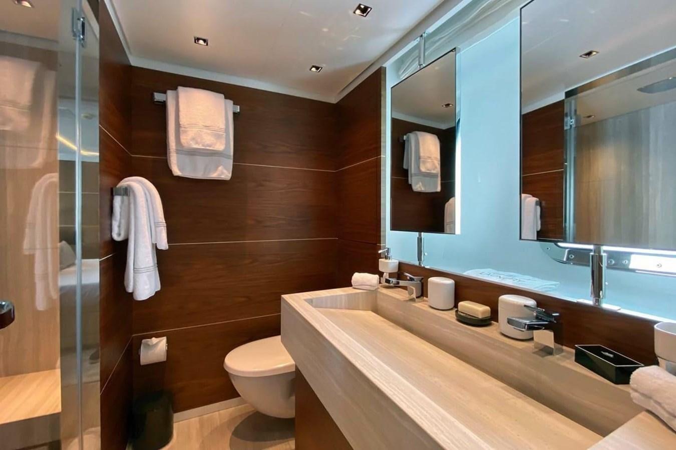 a bathroom with a large mirror aboard LADY A Yacht for Sale