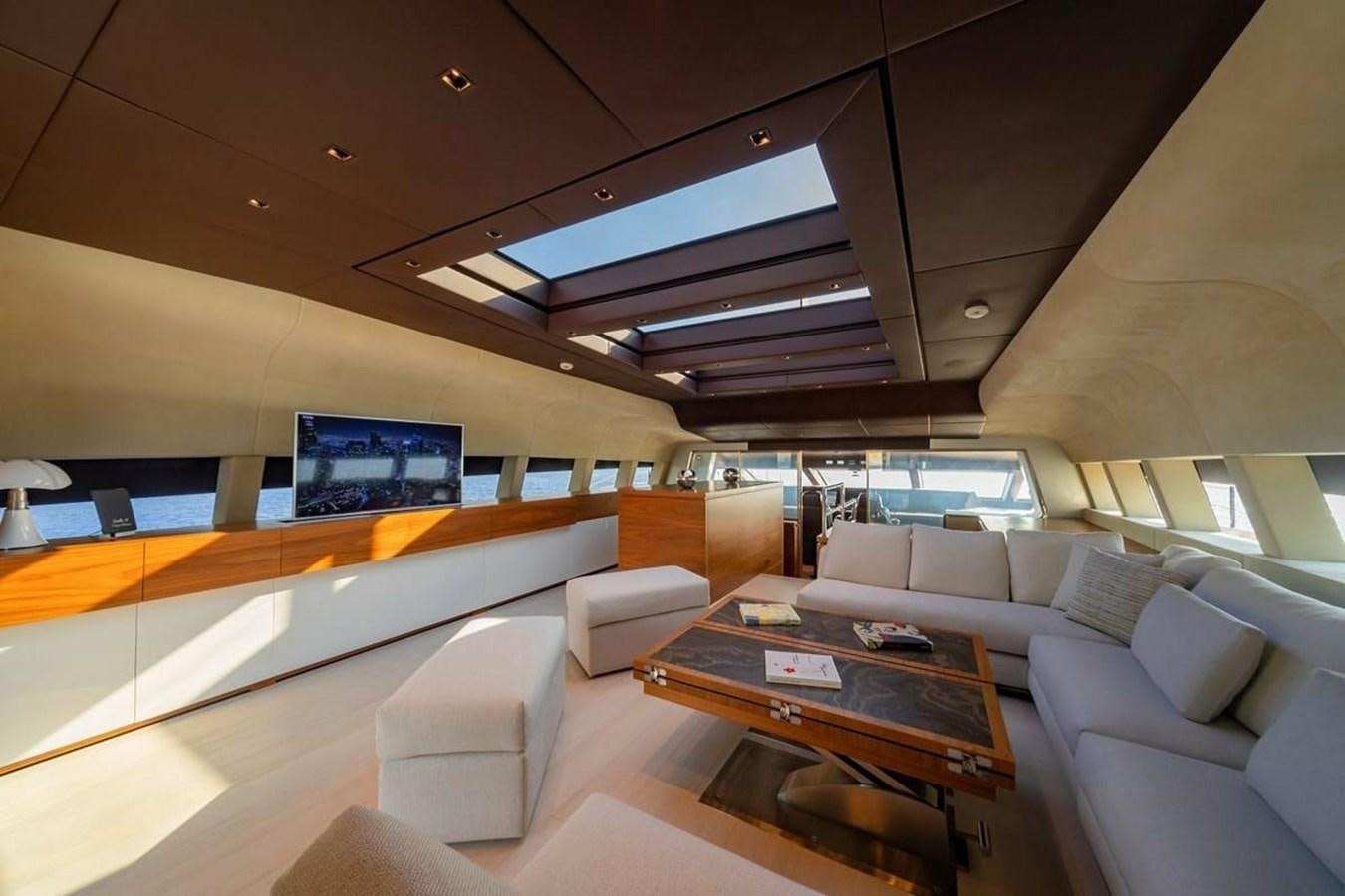 a room with couches and a table aboard LADY A Yacht for Sale