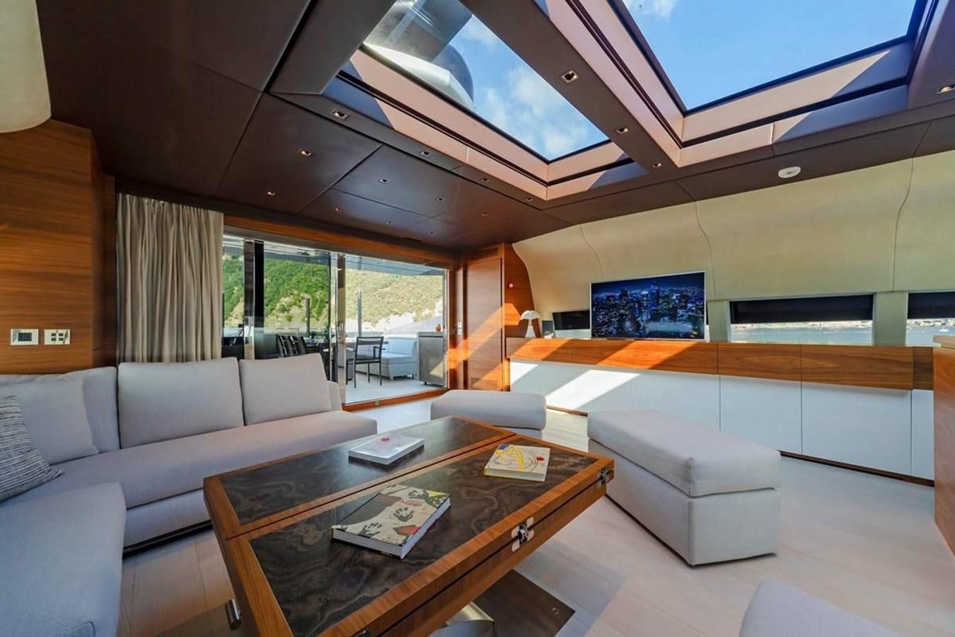 a living room with a large window aboard LADY A Yacht for Sale