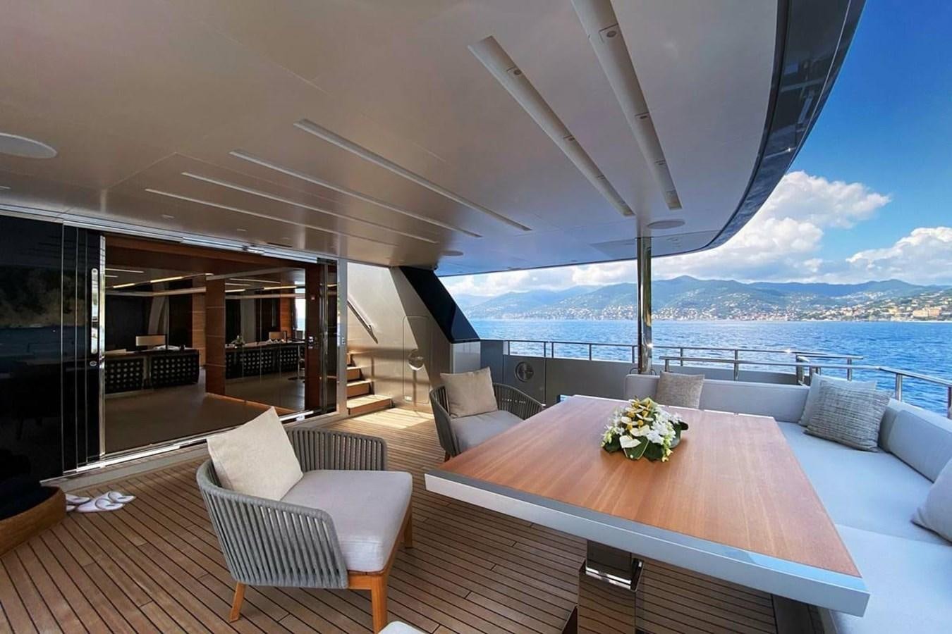 a table and chairs on a deck aboard LADY A Yacht for Sale