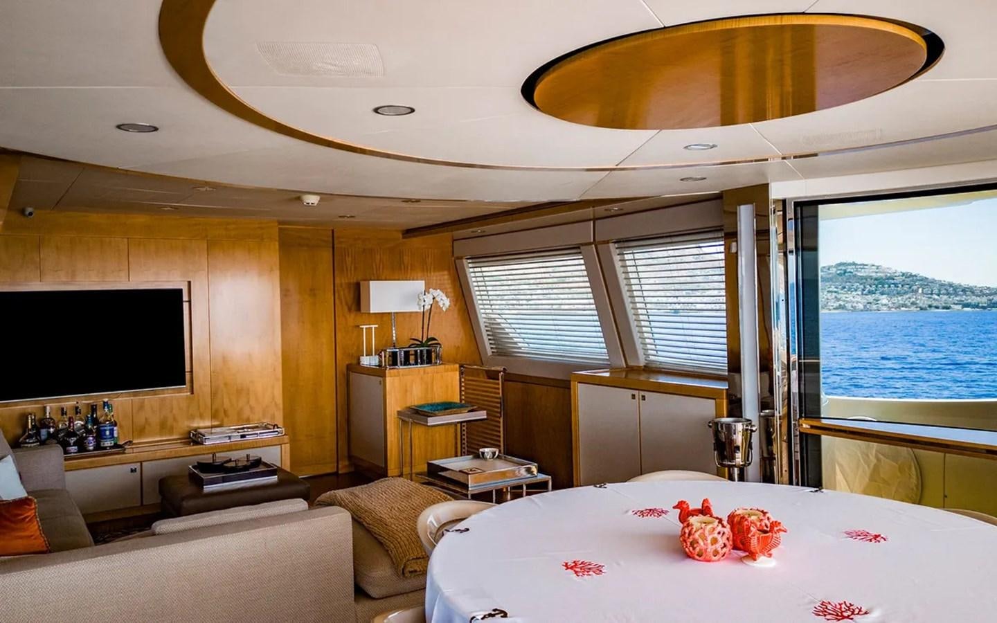 a room with a bed and a tv aboard UNICORN Yacht for Sale