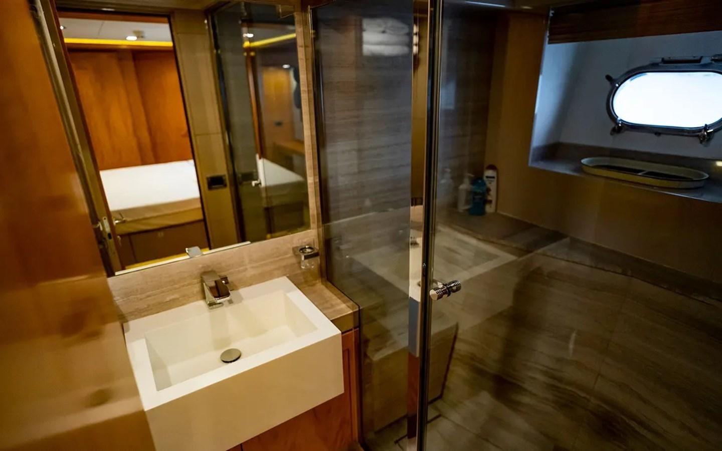 a bathroom with a sink and a mirror aboard UNICORN Yacht for Sale