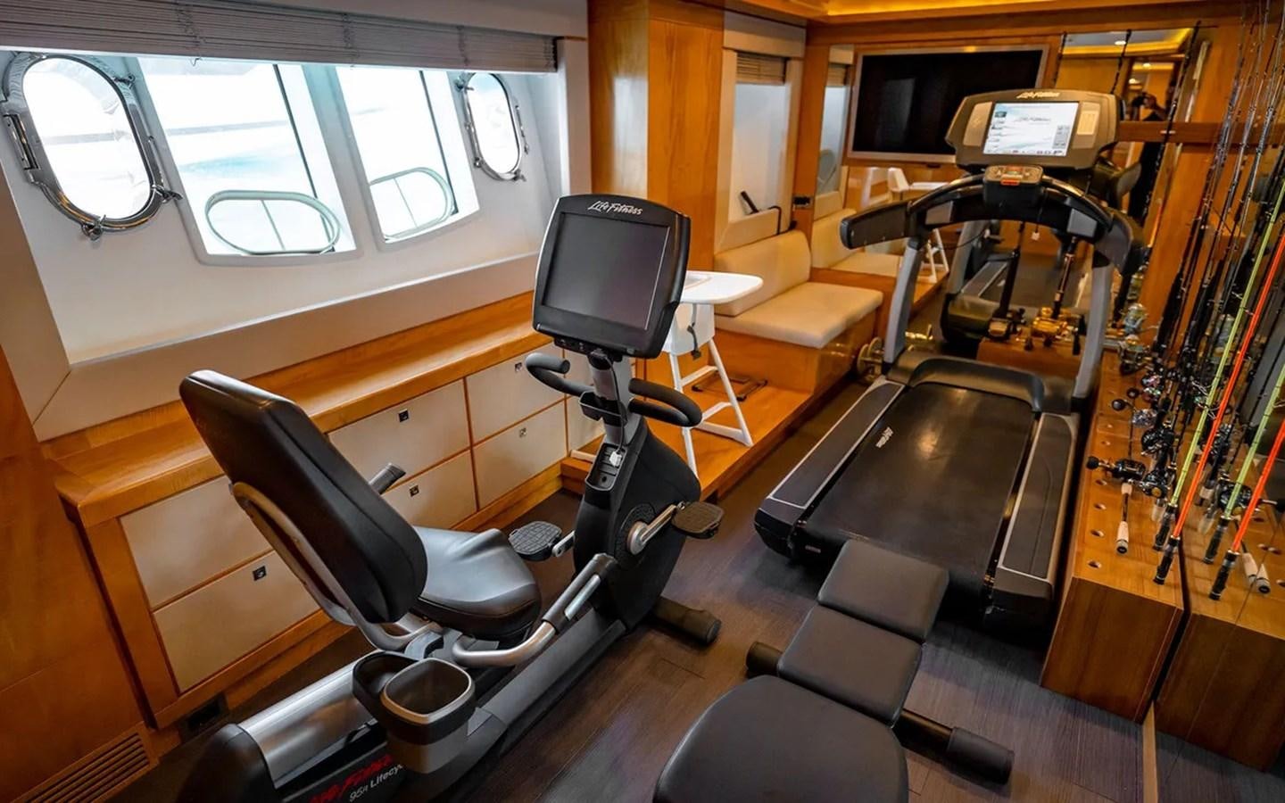 a room with a music player and a piano aboard UNICORN Yacht for Sale