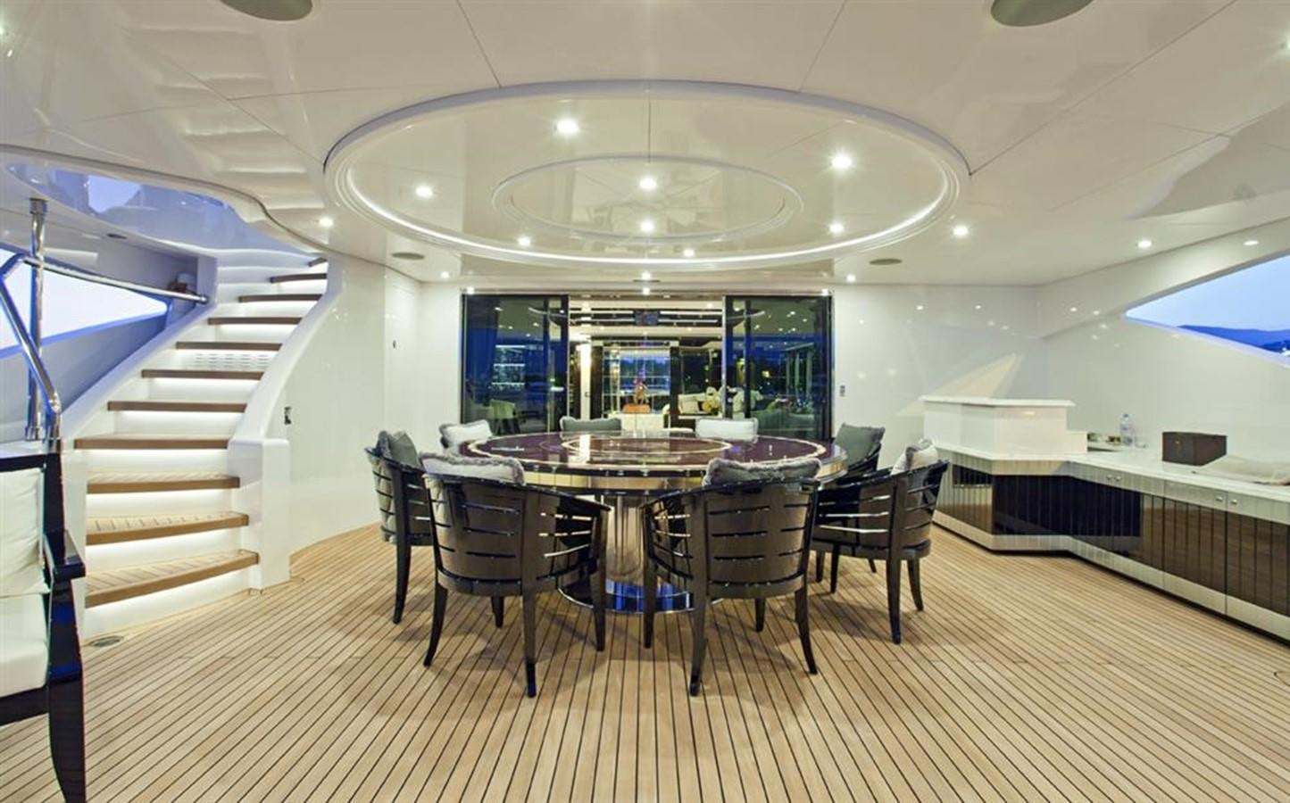 a large room with a table and chairs aboard HOPE & LOVE Yacht for Sale
