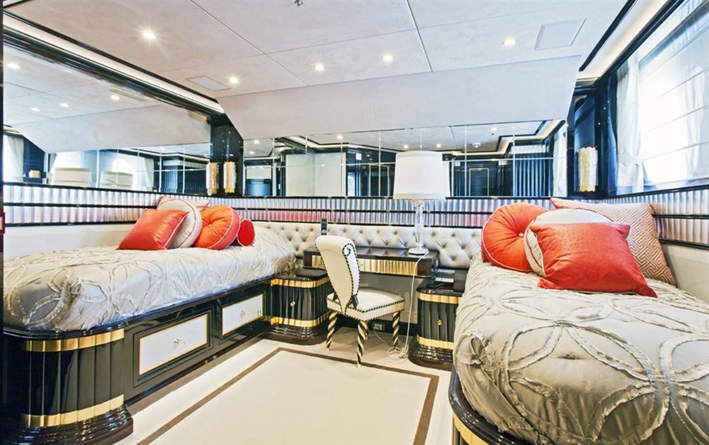 a room with a bed and a chair aboard HOPE & LOVE Yacht for Sale