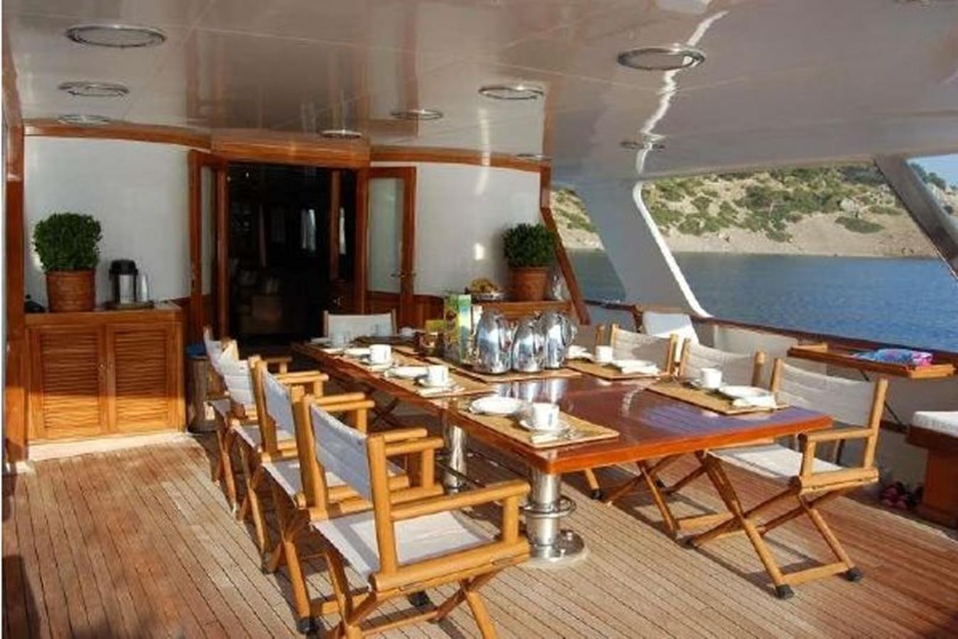a dining room with a table and chairs aboard PATRA Yacht for Sale