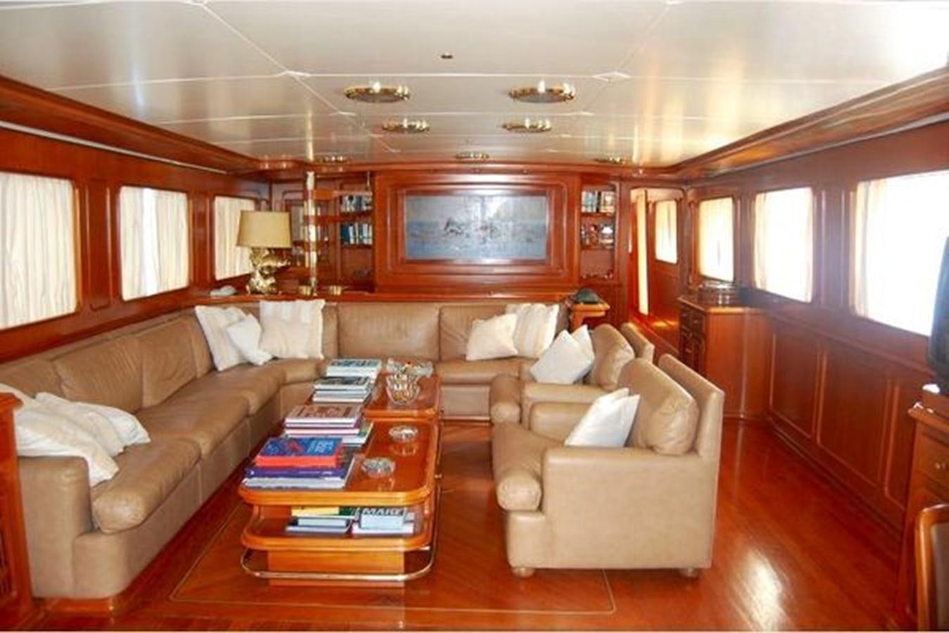 a living room with a couch and a coffee table aboard PATRA Yacht for Sale