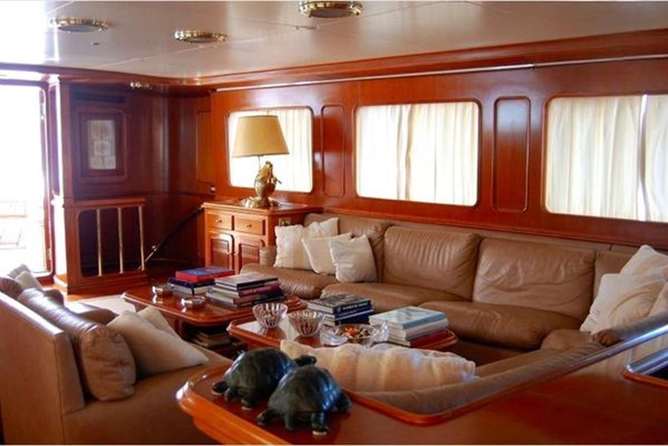 a dog lying on a couch aboard PATRA Yacht for Sale