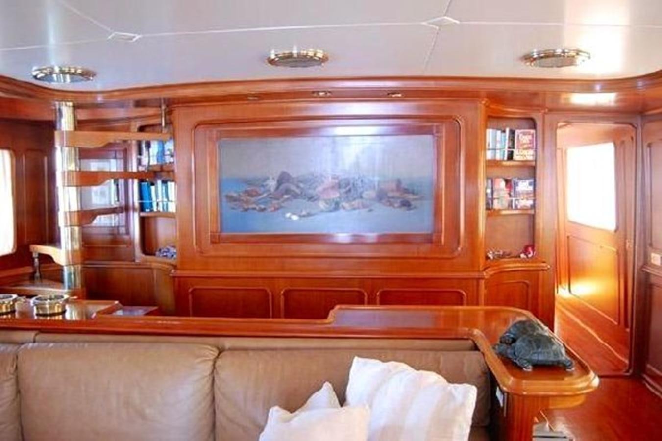 a living room with a large screen aboard PATRA Yacht for Sale