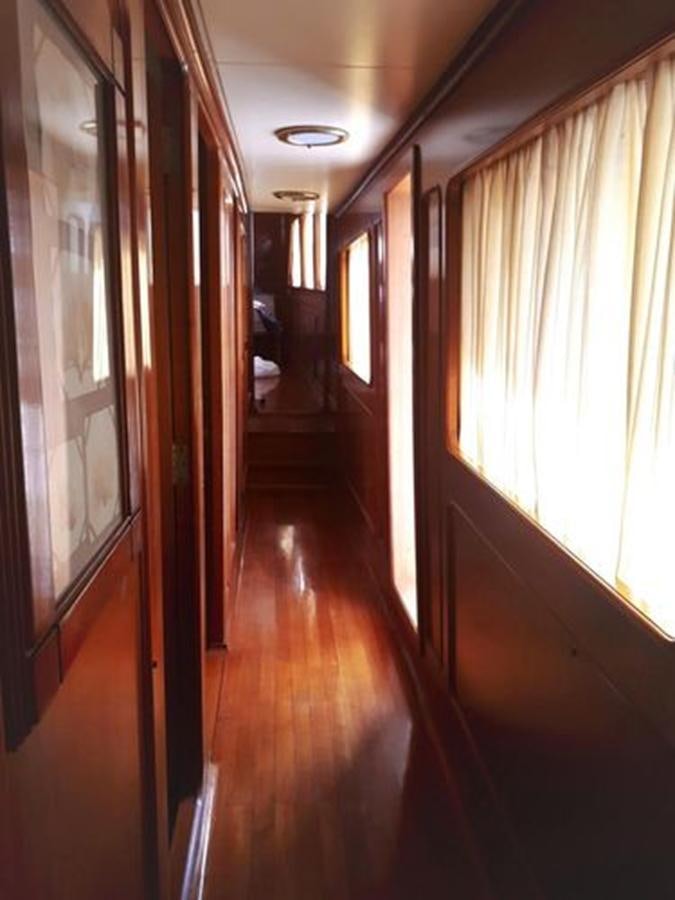 a hallway with a wood floor aboard PATRA Yacht for Sale