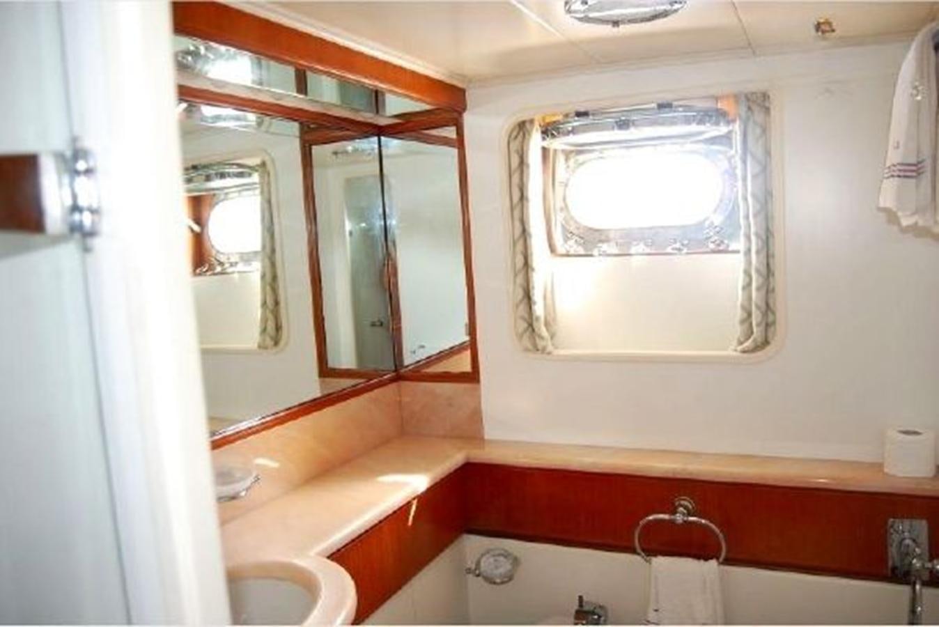 a bathroom with a large mirror aboard PATRA Yacht for Sale