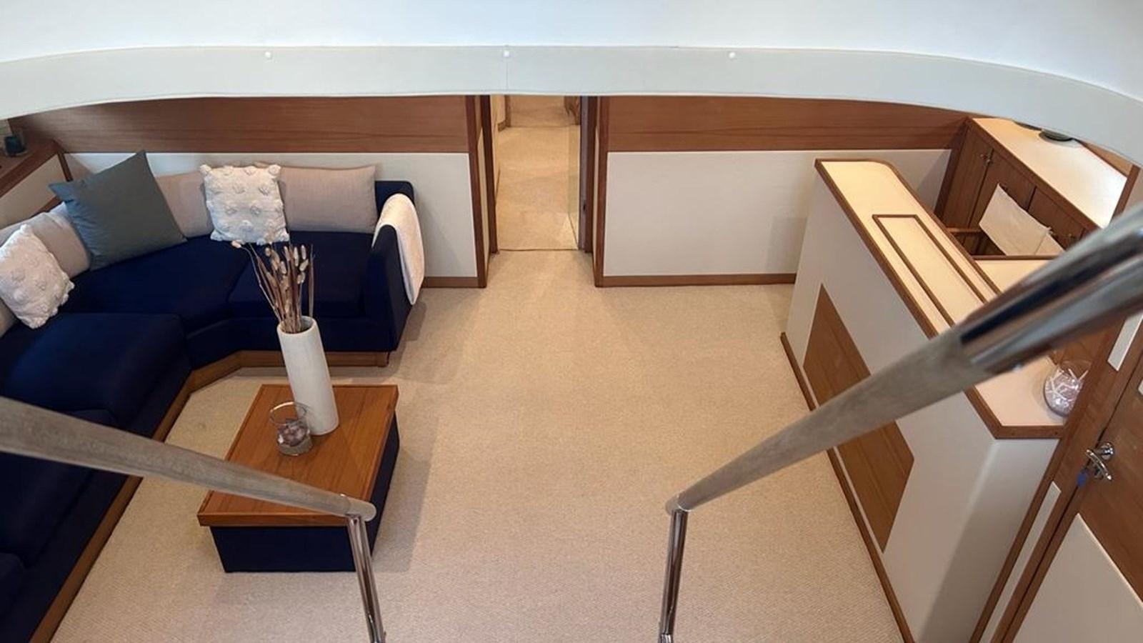 a room with a couch and a table aboard MIDNIGHT MADNESS Yacht for Sale