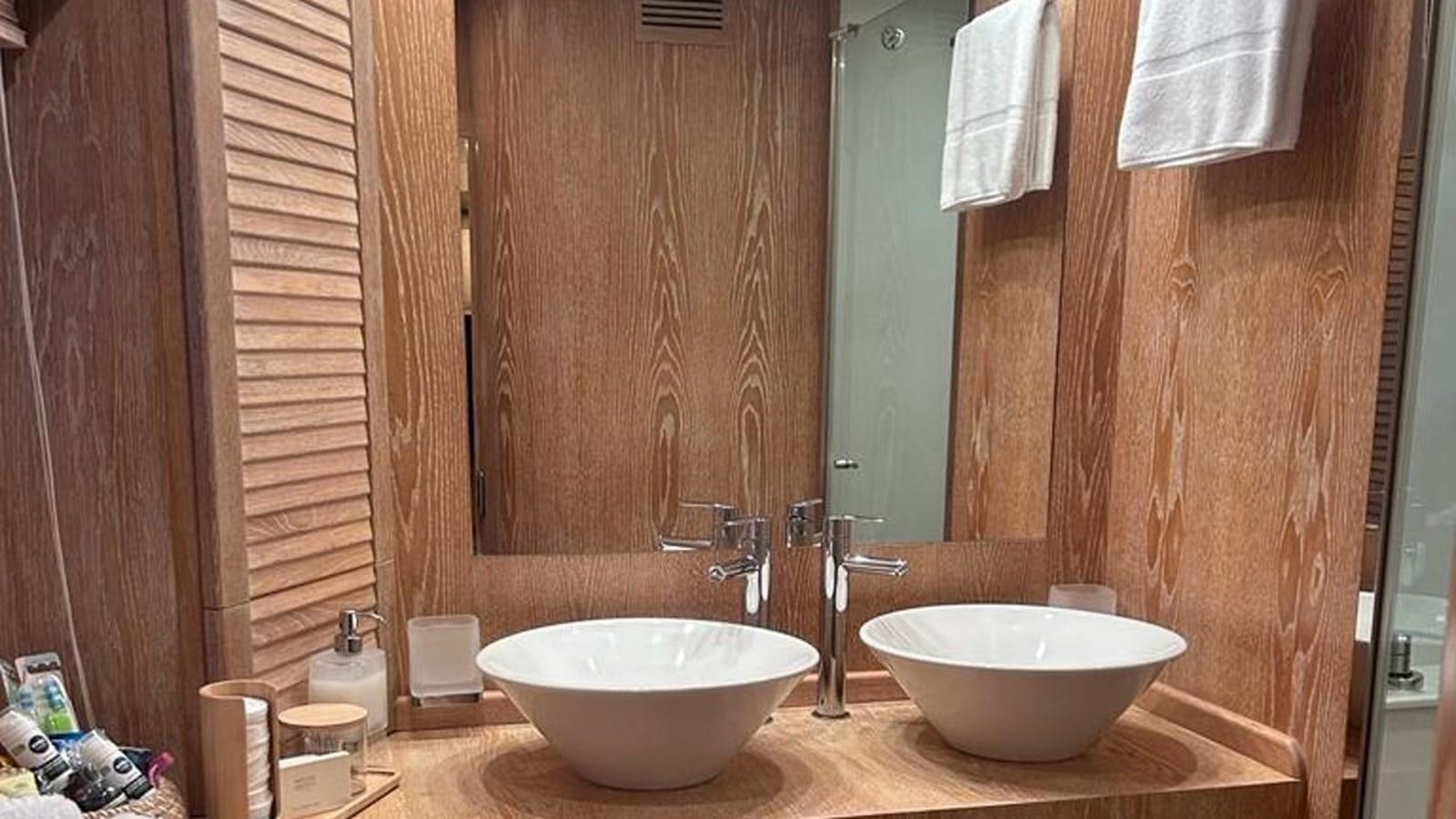 a bathroom with two sinks aboard MIDNIGHT MADNESS Yacht for Sale