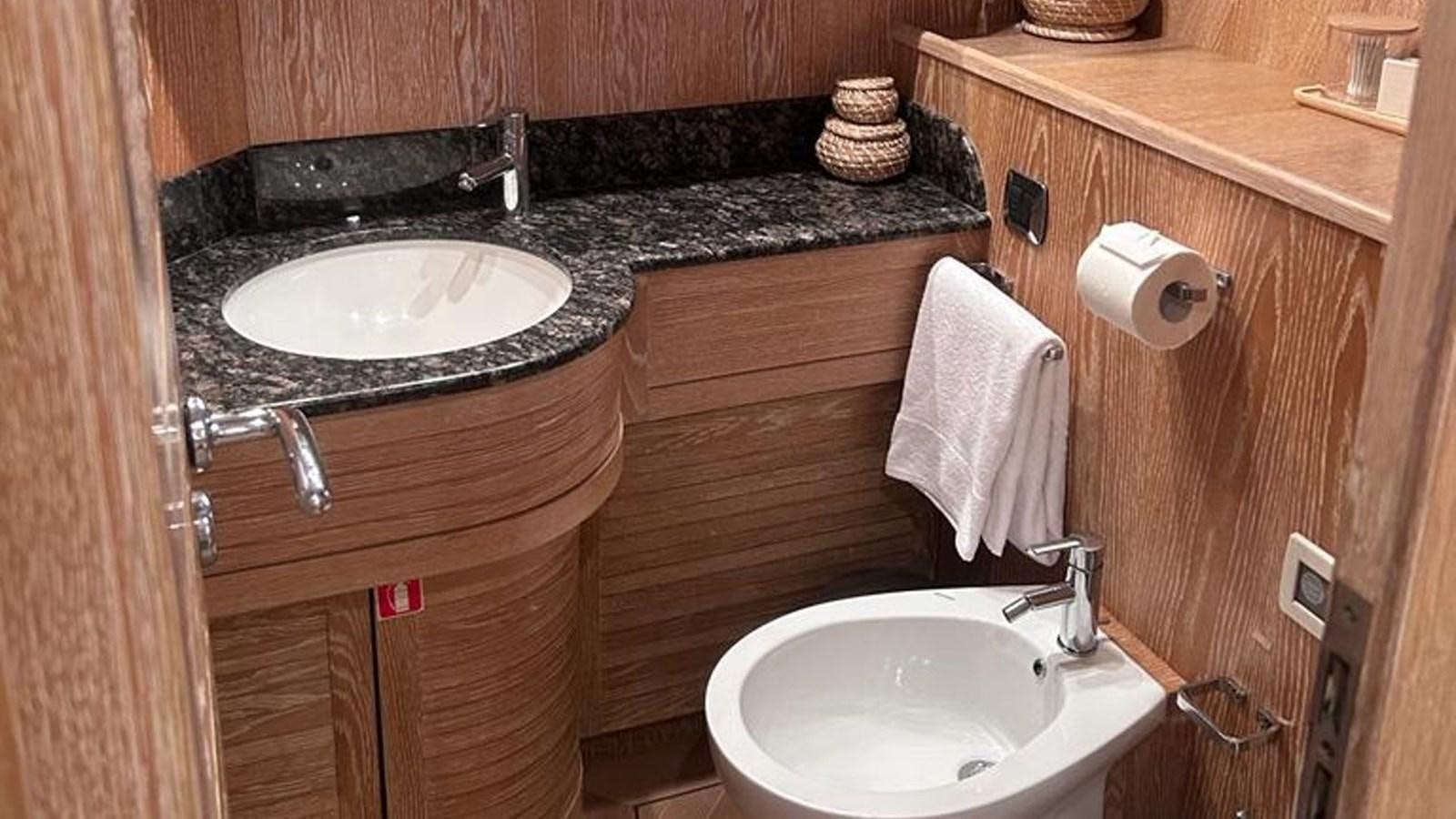 a bathroom with a sink and a mirror aboard MIDNIGHT MADNESS Yacht for Sale