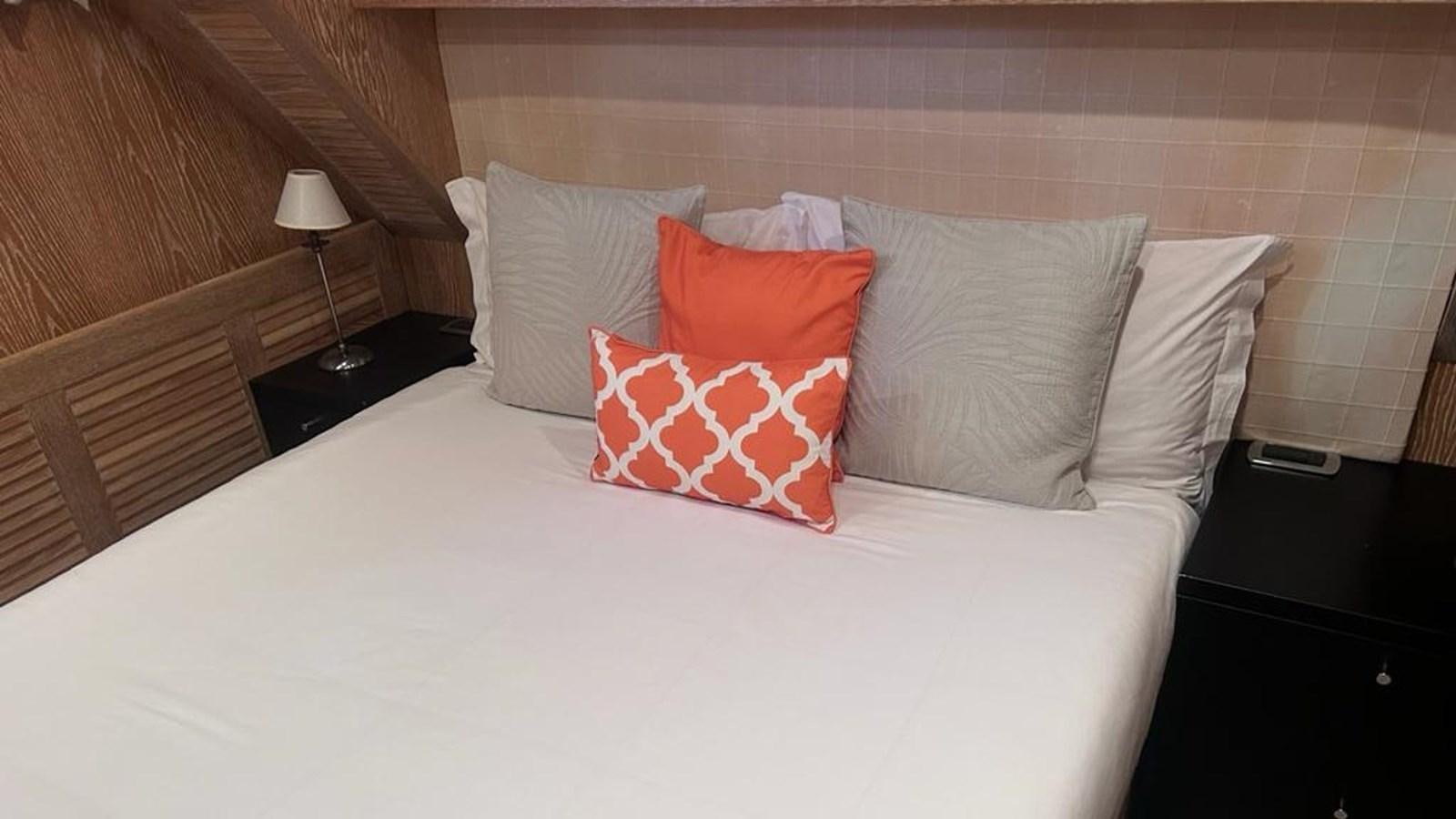 a bed with pillows aboard MIDNIGHT MADNESS Yacht for Sale