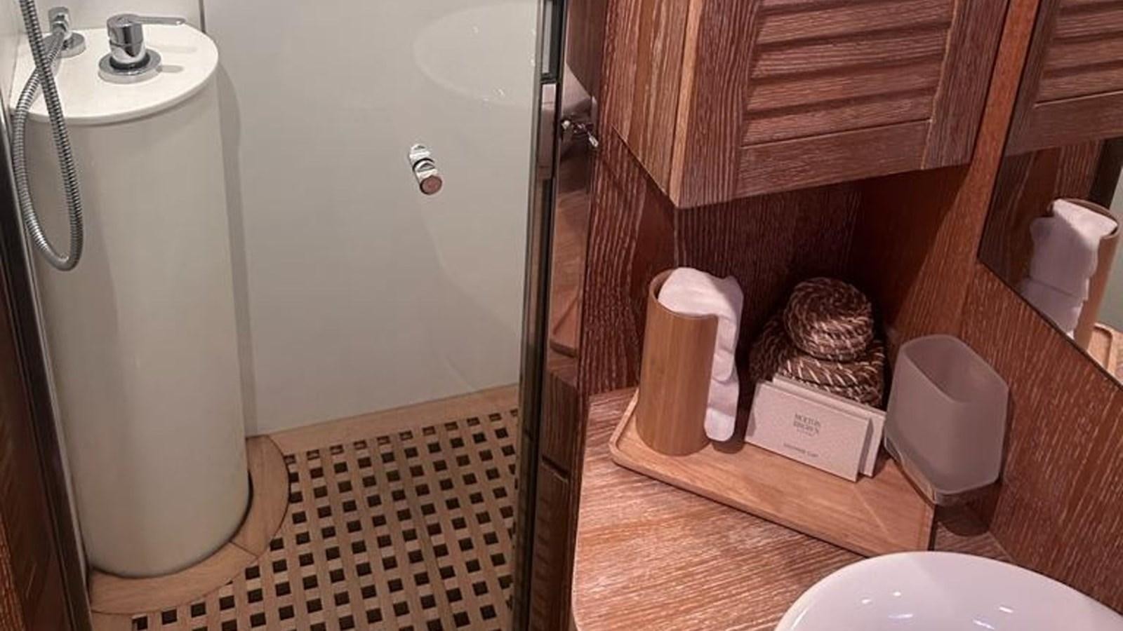 a bathroom with a toilet and a sink aboard MIDNIGHT MADNESS Yacht for Sale