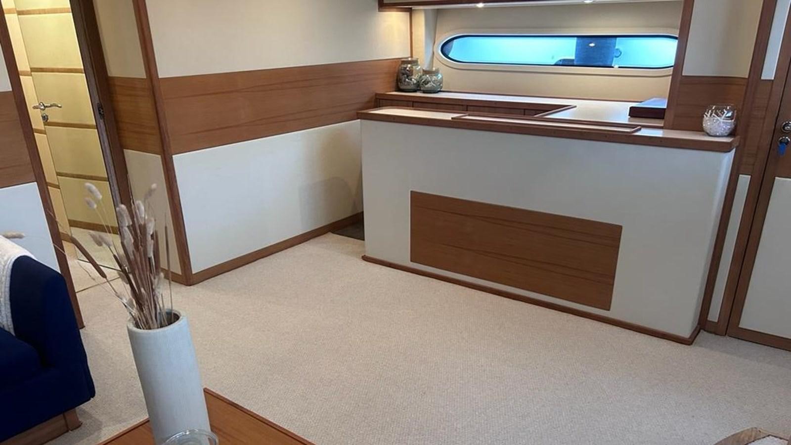 a room with a desk and a television aboard MIDNIGHT MADNESS Yacht for Sale