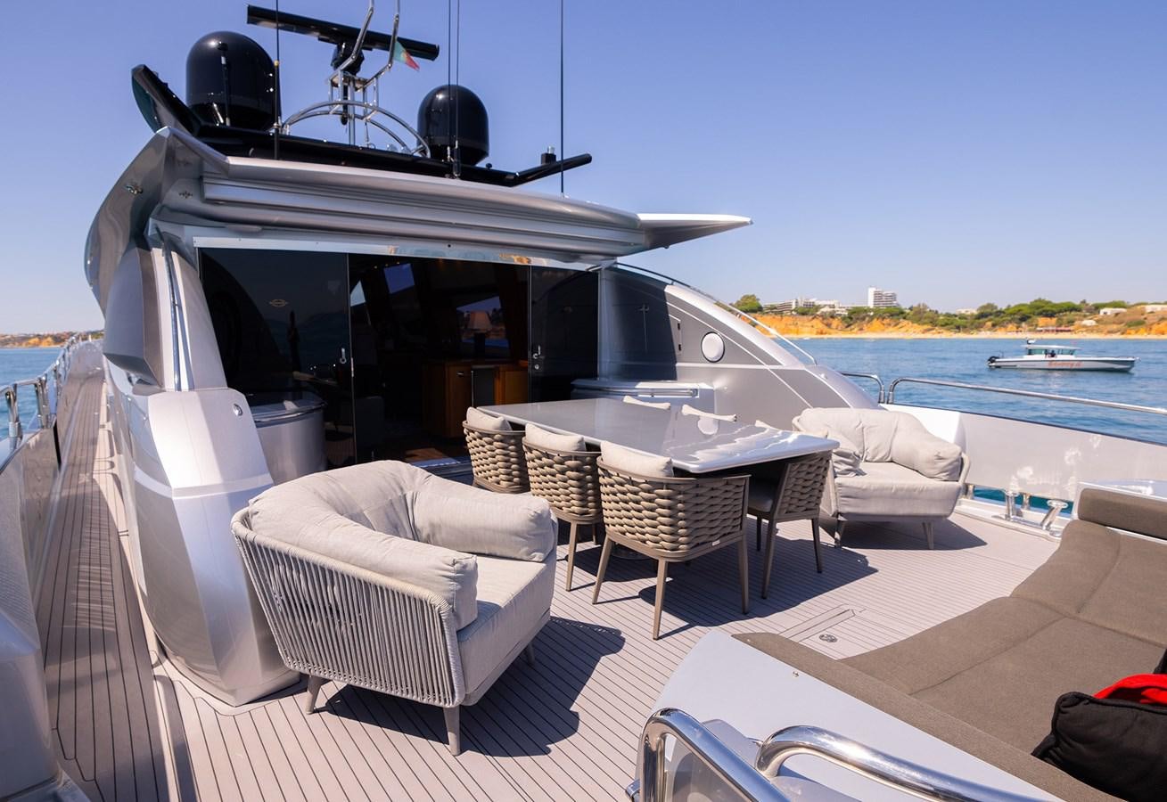 a boat on a deck aboard GEE WHIZZ Yacht for Sale