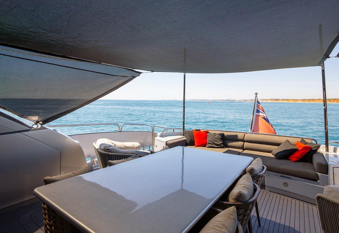 a boat with a deck and chairs on it aboard GEE WHIZZ Yacht for Sale