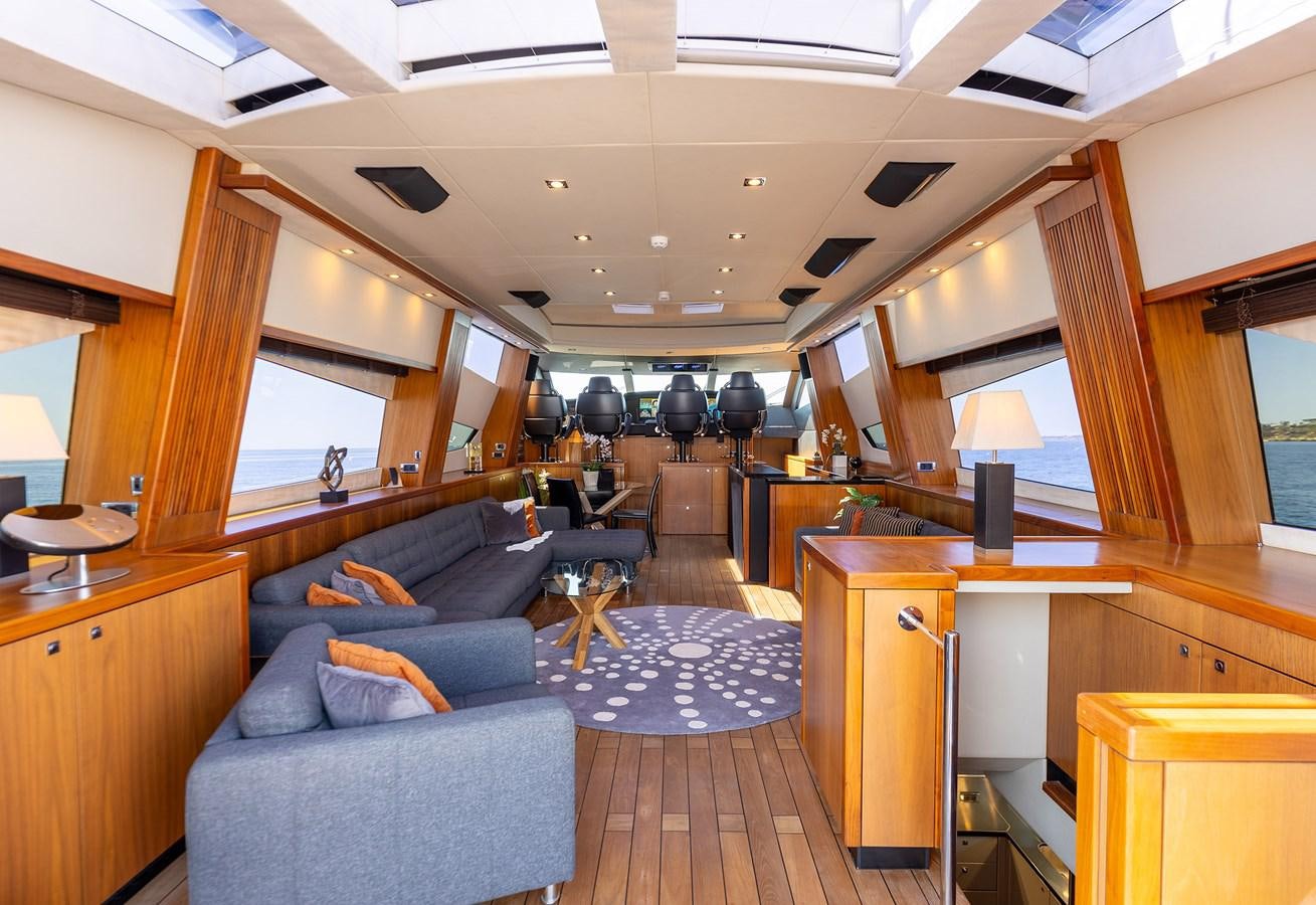 a room with a couch and a desk aboard GEE WHIZZ Yacht for Sale