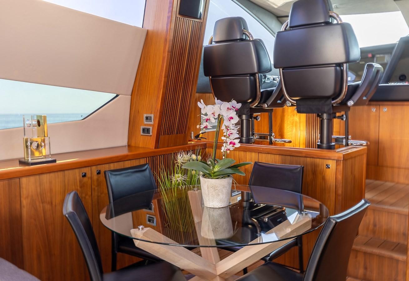 a plant in a pot on a table aboard GEE WHIZZ Yacht for Sale