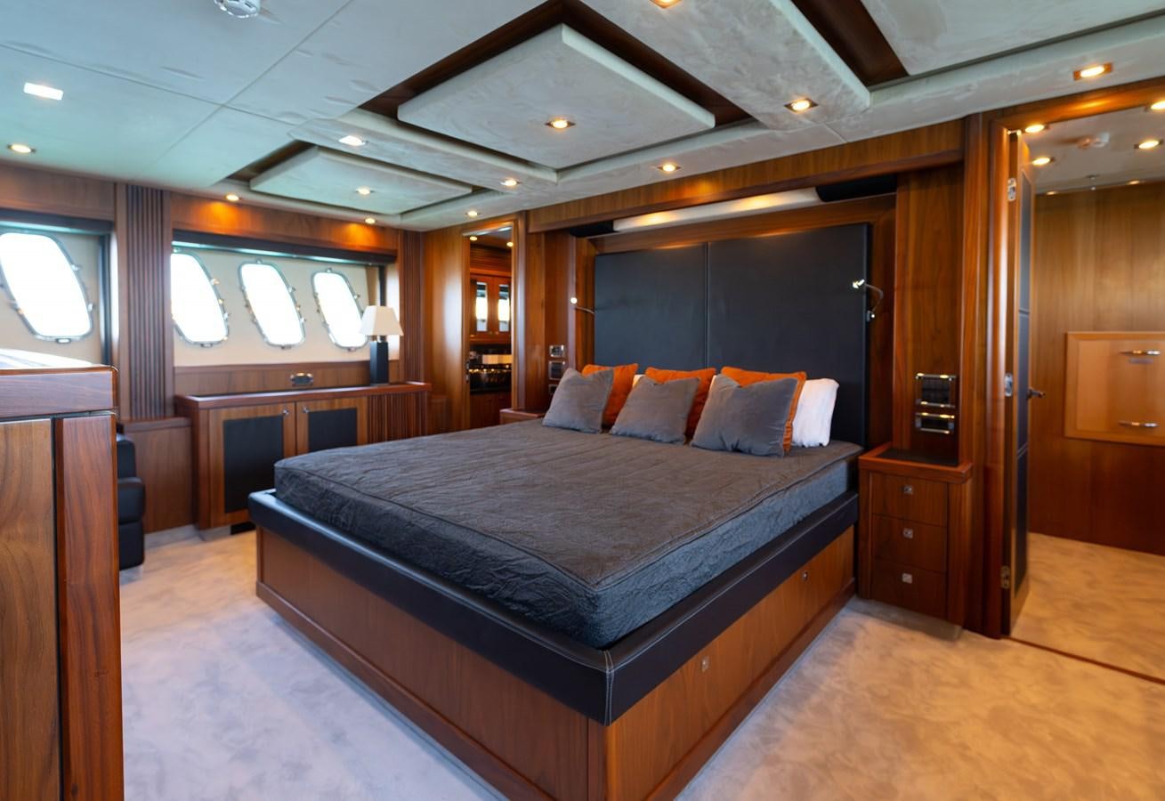 a large bed in a hotel room aboard GEE WHIZZ Yacht for Sale