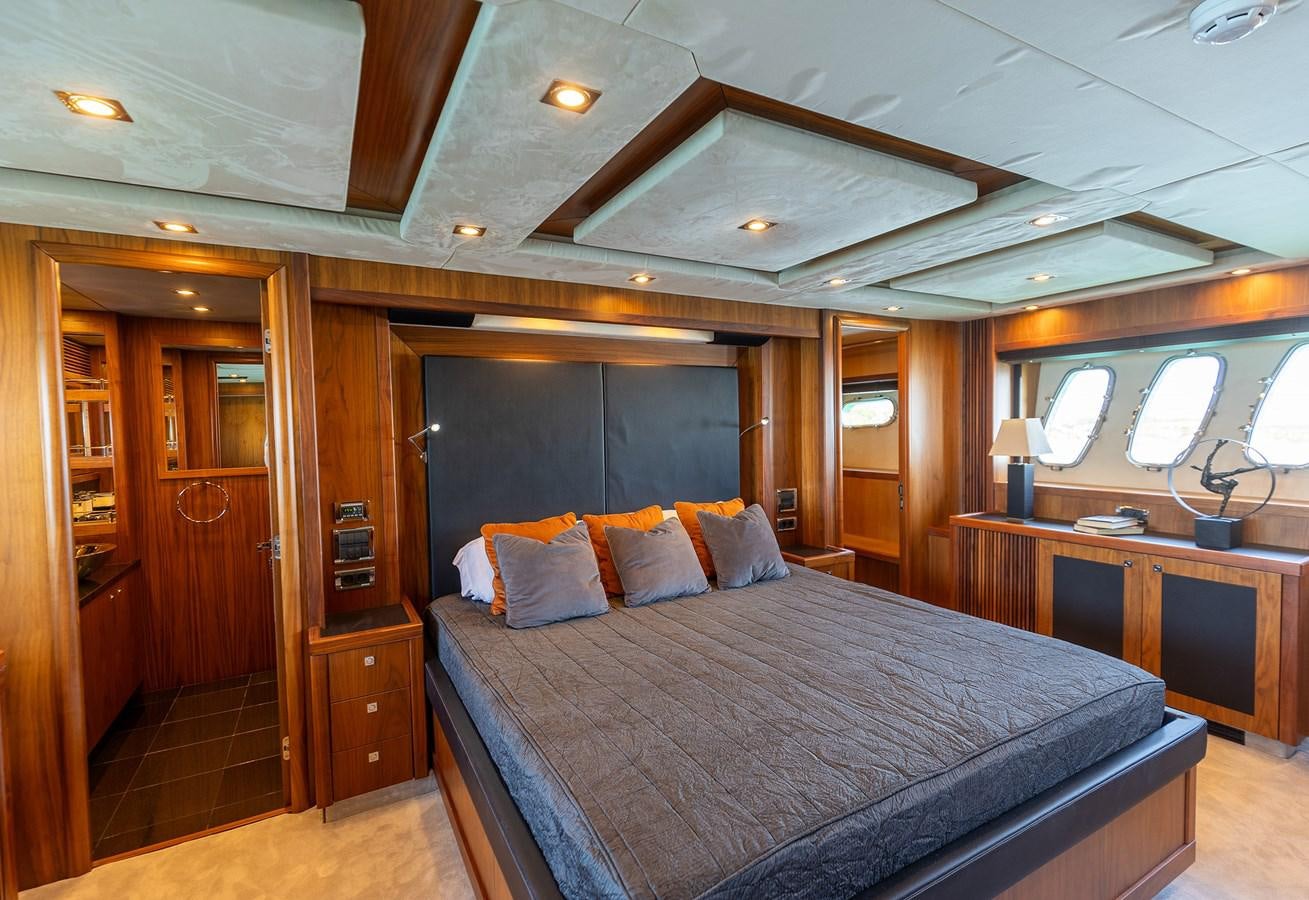 a bed in a room aboard GEE WHIZZ Yacht for Sale