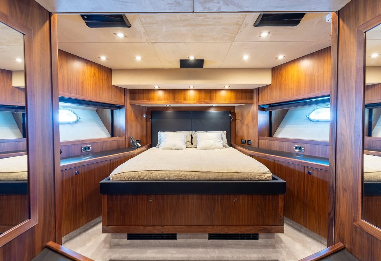 a bed in a wooden room aboard GEE WHIZZ Yacht for Sale