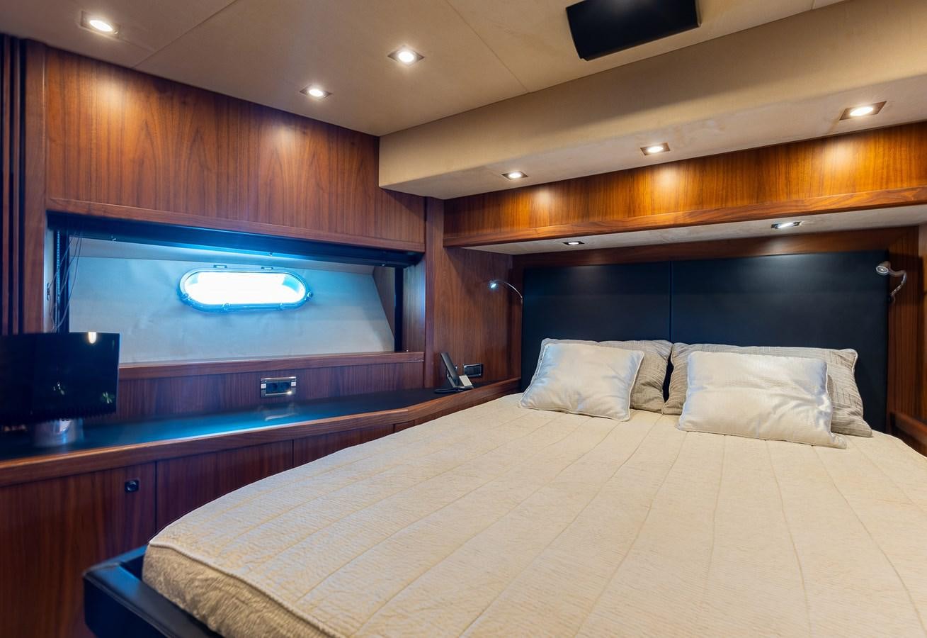 a bed in a room aboard GEE WHIZZ Yacht for Sale