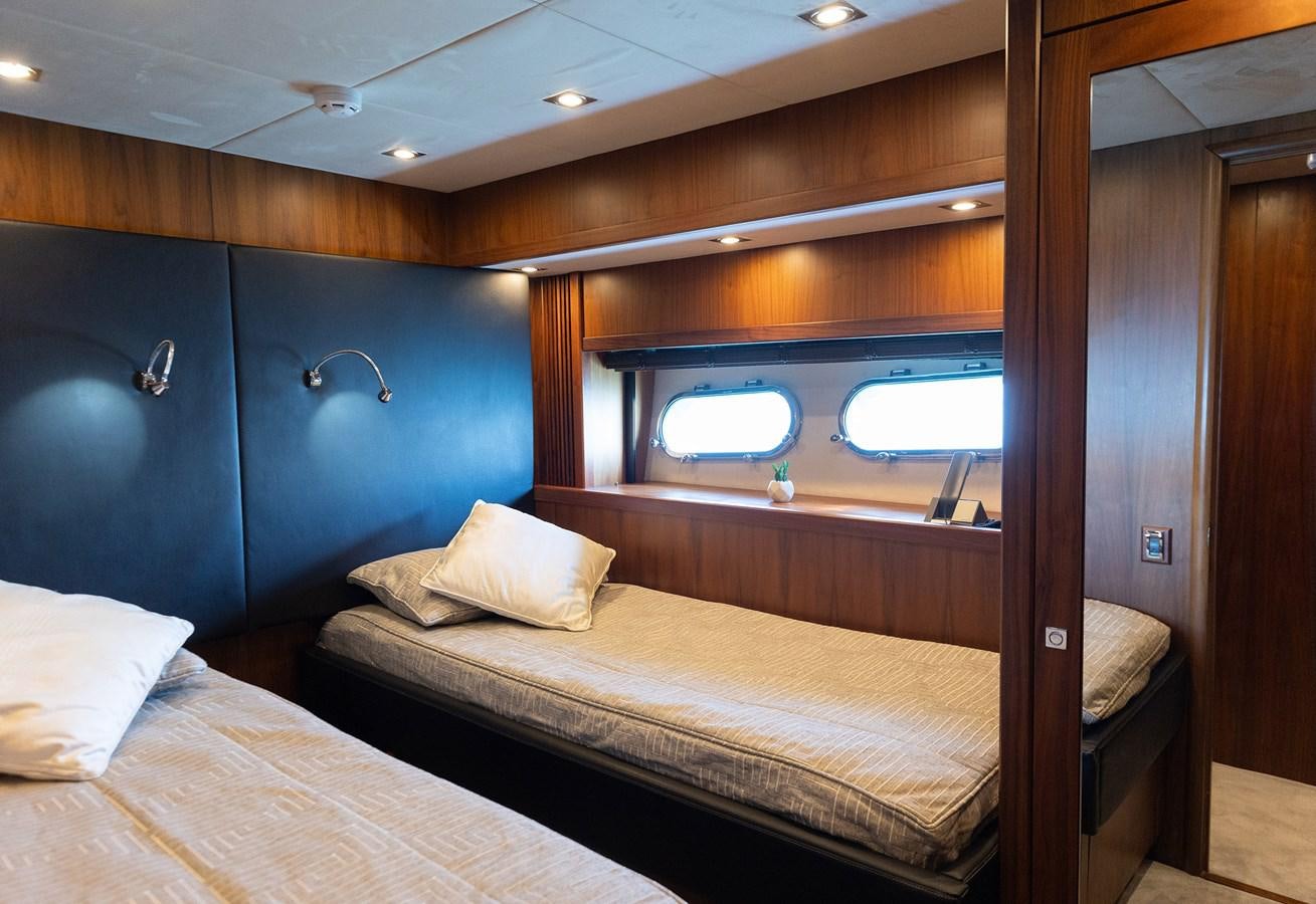 a room with two beds aboard GEE WHIZZ Yacht for Sale
