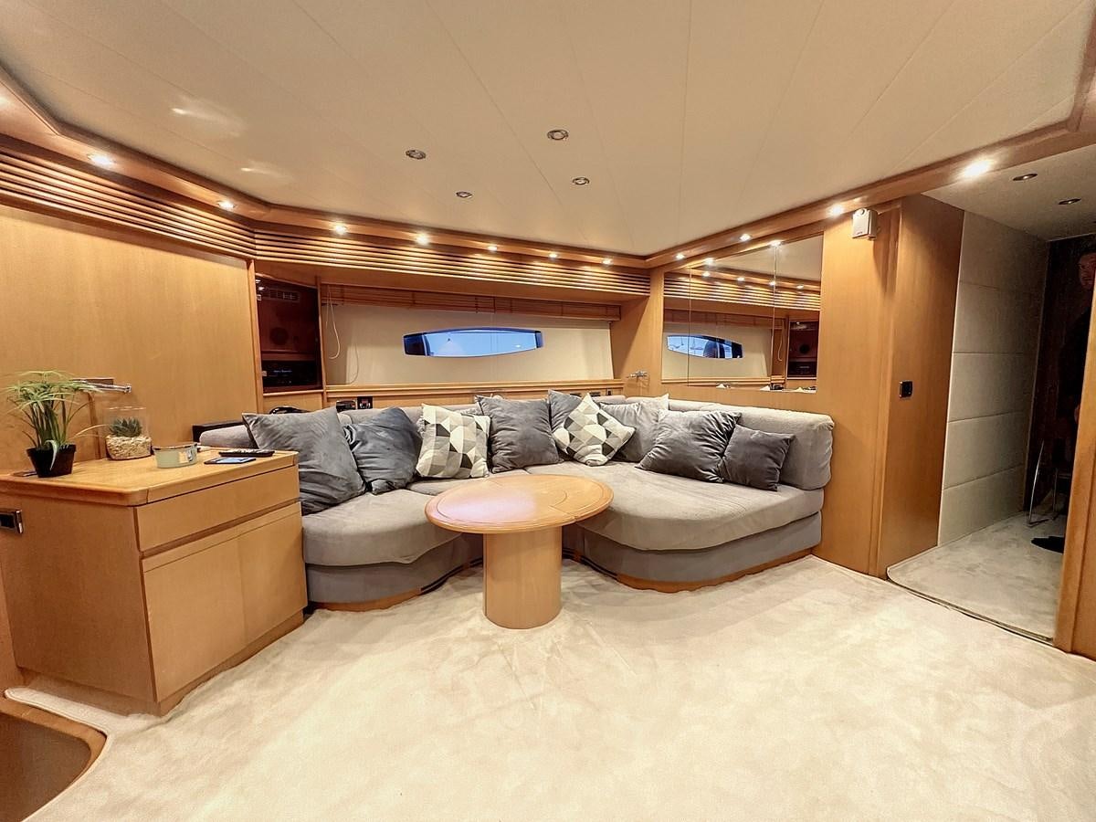 a living room with a couch and a coffee table aboard NAUTILUS Yacht for Sale