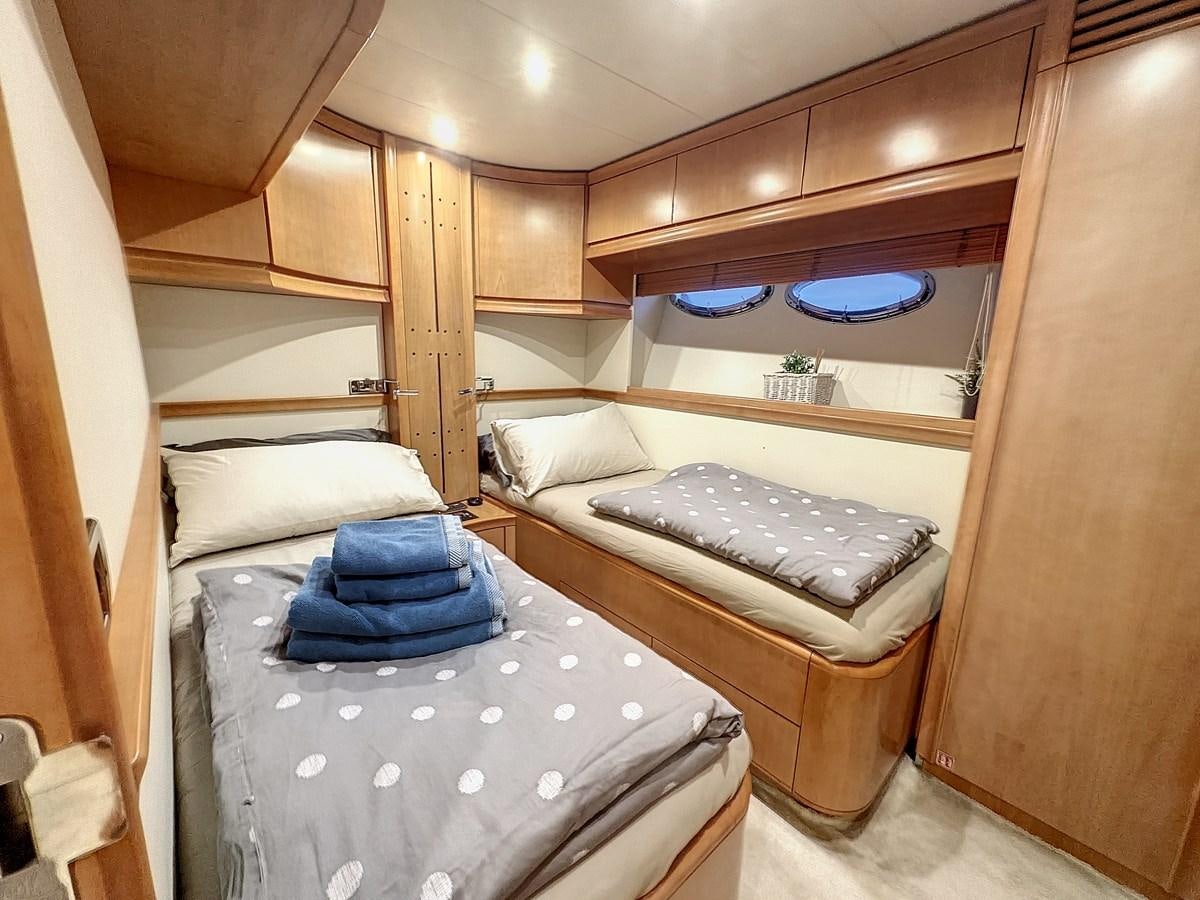 a couple of beds in a room aboard NAUTILUS Yacht for Sale