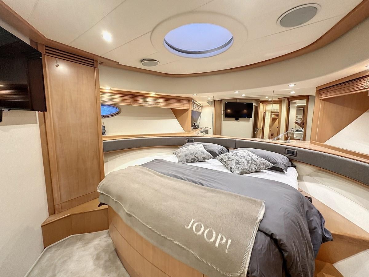 a room with a bed and a window aboard NAUTILUS Yacht for Sale