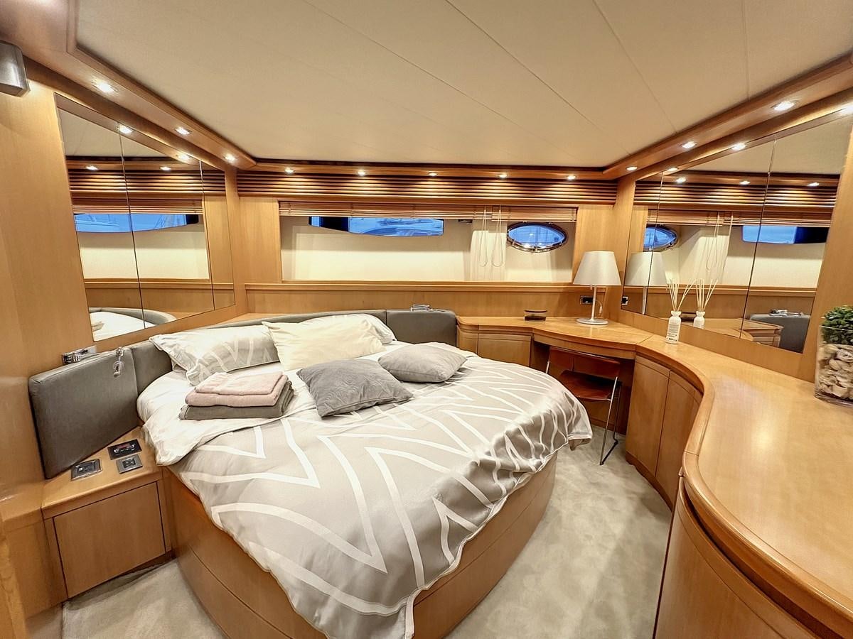 a room with a bed and a desk aboard NAUTILUS Yacht for Sale