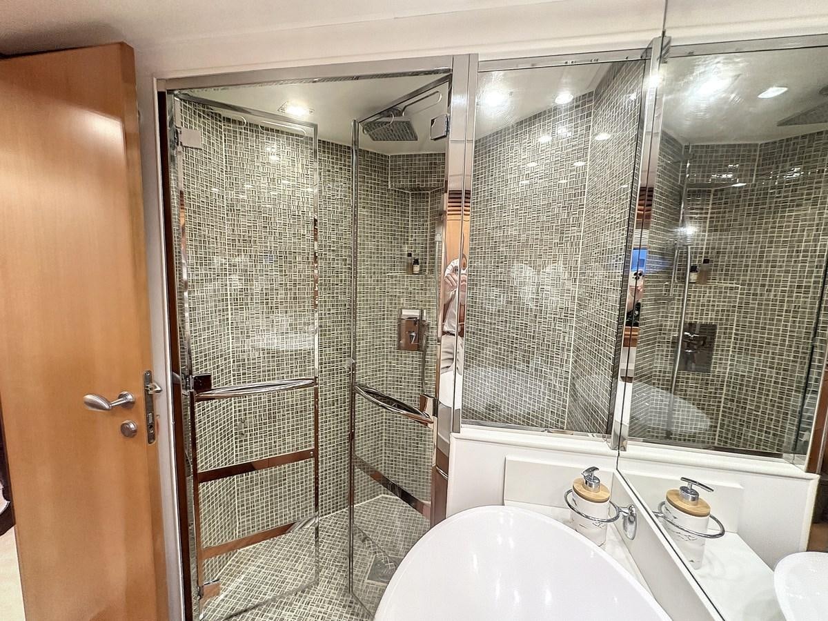 a bathroom with a glass shower aboard NAUTILUS Yacht for Sale